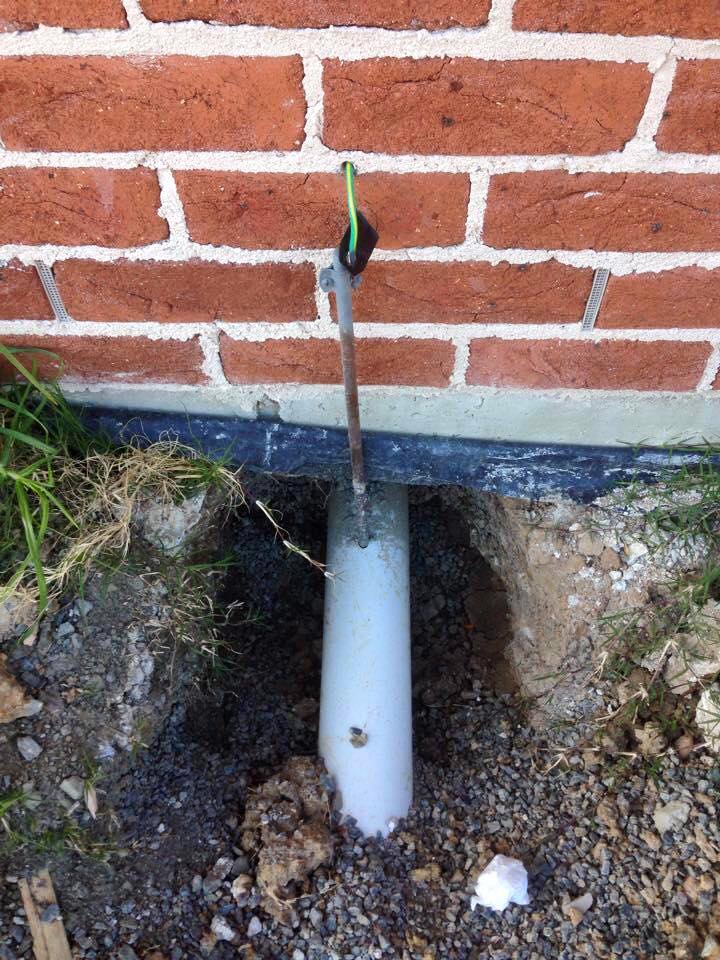 I bet when the electrician drove this ground rod he had no idea that he punctured the sewer line.  Unless you had this sewer line scoped you might never had known, until you moved in.